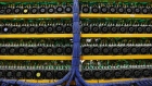 Mining machines stand at the Bitfarms cryptocurrency farming facility in Farnham, Quebec, Canada, on Wednesday, Jan. 24, 2018. Bitfarms says it's making more than $250,000 a day from minting Bitcoin, other virtual currencies and fees at four sites in the province. 