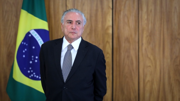 Michel Temer, Brazil's president, waits for ambassadors during a ceremony of accreditation at the Planalto Palace in Brasilia, Brazil, on Wednesday, April 25, 2018. Temer received credentials from ten ambassadors today, making their diplomatic roles in Brazil official. Photographer: Andre Coelho/Bloomberg
    