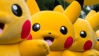 Performers dressed as the Pikachu character from Nintendo Co.'s Pokemon franchise march during the Pikachu Carnival Parade organised by Pokemon Co. in Yokohama, Japan, on Monday, Aug. 14, 2017. About 60 million people still play the Pokemon Go mobile game each month, according to data from mobile app research firm Apptopia, and one in five of those players opens the game on a daily basis. 