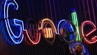 The Google Inc. logo hangs illuminated at the company's exhibition stand at the Dmexco digital marketing conference in Cologne, Germany. 
