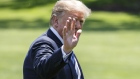 U.S. President Donald Trump waves while walking on the South Lawn of the White House in Washington, D.C., U.S., on Friday, May 25, 2018. Trump announced plans to nominate a retired foreign service officer affiliated with an organization that critics call an anti-immigrant hate group to run the State Department bureau overseeing refugee protection and resettlement. 