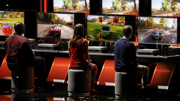 Visitors play the Forza Horizon 4 video game during the Xbox event on June 10. Photographer: Patrick T. Fallon/Bloomberg
