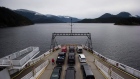 A passenger walks on the vehicle deck of the B.C. Ferries' vessel Island Sky