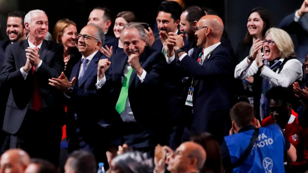 Delegates of Canada, Mexico and the U.S. after winning a joint bid to host the 2026 World Cup 