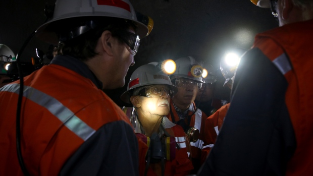 Nelson Pizarro, chief executive officer of Coldeco Metals Inc., center, speaks with employees inside the company's Teniente copper mine near Rancagua, Chile, on Wednesday, March 21, 2018. Mining veteran Pizarro has spent more than half a century working in mines and has dedicated the last four years to turning the world's largest copper producer into a profitable company. Photographer: Laura Millan Lombrana/Bloomberg