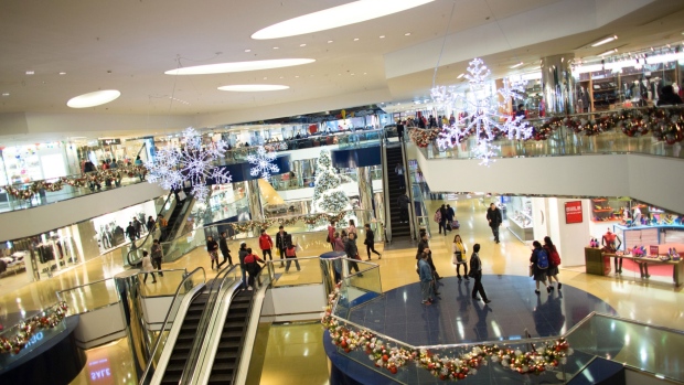 Christmas decorations hang from the ceiling at Cityplaza shopping mall, operated by Swire Properties Ltd., in the Taikoo Shing area of Hong Kong, China, on Wednesday, Dec. 18, 2013. The Hong Kong economy will expand 1.6% in the fourth quarter, according to the latest results of a Bloomberg News survey of 23 economists conducted from Dec. 12 to Dec. 17.