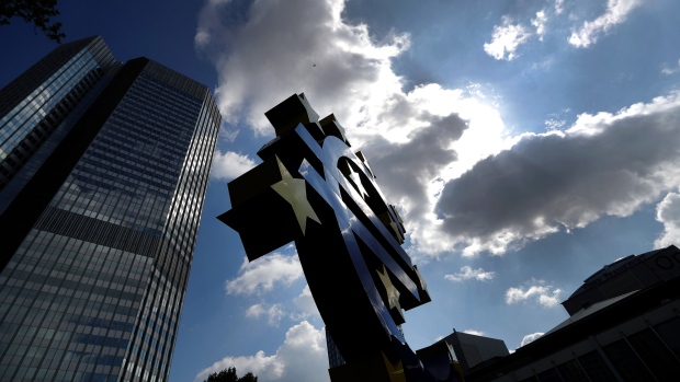 The euro sign sculpture stands near the former European Central Bank (ECB) headquarters in Frankfurt, Germany, on Wednesday, April 25, 2018. About 8,000 additional jobs may be created in Frankfurt’s banking industry, a statement from the Government of Hesse state says, citing estimates by Helaba Research. 