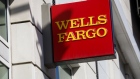 Signage is displayed outside a Wells Fargo & Co. bank branch in Los Angeles, California, U.S., on Thursday, April 19, 2018. Wells Fargo & Co.'s financial ties to gunmakers and the National Rifle Association have prompted the American Federation of Teachers to remove the bank from its list of recommended mortgage lenders. 
