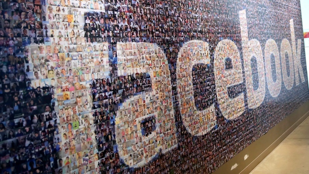 Signage made up of individual faces is displayed inside the Facebook Inc. Prineville Data Center in Prineville, Oregon, U.S., on Monday, April 28, 2014. 