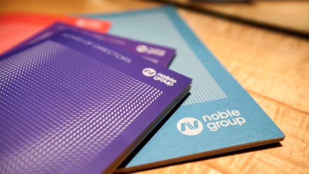Noble Group Ltd. booklets sit on a table before a news conference during an investor day in Singapore, on Monday, Aug. 17, 2015.  