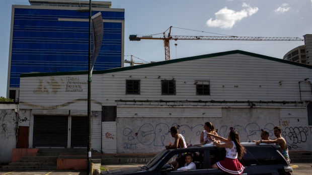 A store with the words "Total Sales" is seen in Las Mercedes in Caracas Venezuela, today Thursday June 15 2018. Even with the deepest crisis in its history, Caracas is facing a increase in construction of high class condos and office buildings. Photographer: Manaure Quintero/Bloomberg