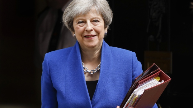 Theresa May, U.K. prime minister, departs number 10 Downing Street to attend a weekly questions and answers session in Parliament in London, U.K., on Wednesday, June 20, 2018. May is facing a revolt from Conservative Party lawmakers over whether she should have the power to take the U.K. out of the European Union without a deal, or if Parliament should have control over the way forward in the event that talks break down. 