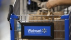 The Wal-Mart Stores Inc. logo is displayed on a shopping cart inside the company's location in Burbank, California, U.S., on Tuesday, Nov. 22, 2016. 