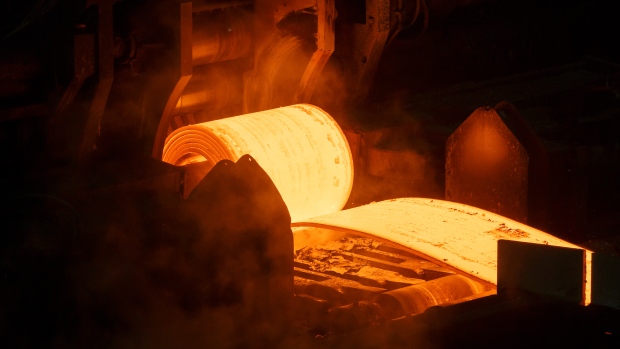 A steel slab moves through a machine at a plant in Ontario, Canada.