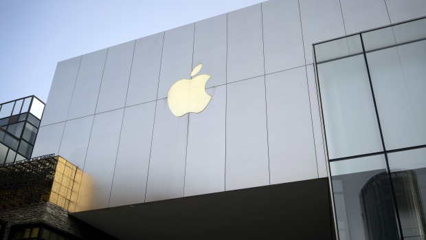 The Apple logo is displayed outside the Apple Store at Sanlitun in Beijing, China
