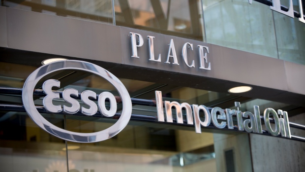 Esso and Imperial Oil signage is displayed on Fifth Avenue place in Calgary, Alberta, Aug. 14, 2013