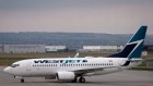 WestJet planes are seen at the Calgary Airport in Calgary, Alta., Thursday, May 10, 2018.