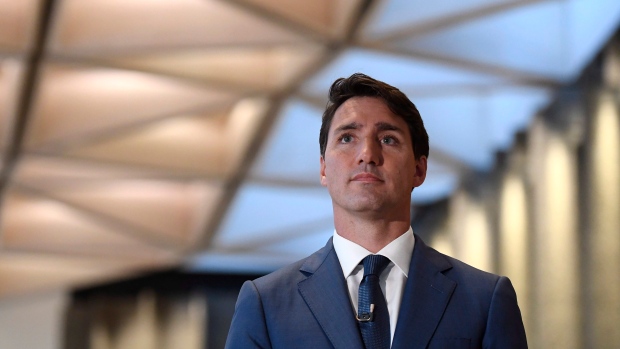 Prime Minister Justin Trudeau waits to be introduced before an an armchair discussion with Maclean's
