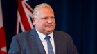 Ontario Premier Doug Ford speaks to members of his caucus in Toronto, Sept. 24, 2018