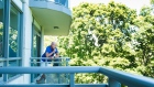 Gerald Major, 46, uses a vaporizer with medical marijuana on his back balcony at Oakville condo. 