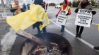 Striking Canada Post workers walk the picket line in Mississauga, Ontario 