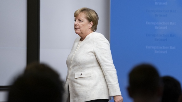 Angela Merkel, Germany's chancellor and leader of the Christian Democratic Union (CDU) party, pauses while speaking during a news conference at the CDU headquarters in Berlin, Germany, on Monday, June 18, 2018. Merkel has accepted a two-week deadline over tougher migration policy set by Interior Minister Horst Seehofer, who leads her Bavarian coalition partner, according to a person familiar with the matter. Photographer: Krisztian Bocsi/Bloomberg
