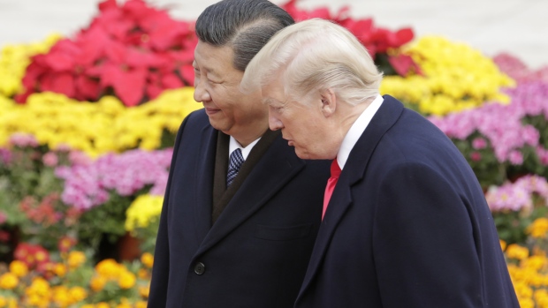 U.S. President Donald Trump, right, speaks with Xi Jinping, China's president, during a welcome ceremony outside the Great Hall of the People in Beijing, China. Photographer: Qilai Shen/Bloomberg