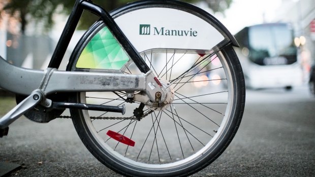 Manulife Financial Corp. signage is displayed on a bicycle in Montreal, Quebec, Canada, on Monday, Aug. 20, 2018
