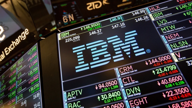 FILE: A monitor displays International Business Machines Corp. (IBM) signage on the floor of the New York Stock Exchange (NYSE) in New York, U.S., on Monday, Aug. 20, 2018. IBM’s $33 billion purchase of Red Hat Inc. -- the world’s second-largest technology deal ever -- is aimed at catapulting the company into the ranks of the top cloud software competitors. 