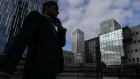 A pedestrian walks in the Canary Wharf business, financial and shopping district in London, U.K., on Thursday, June 5, 2018. The owners of a Canary Wharf skyscraper leased to Citigroup Inc. are seeking to refinance the 661 million-pound ($882 million) loan used to buy it five years ago, two people with knowledge of the plan said. 