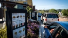 Customers wait in line to make a purchase at the drive-thru of a Starbucks Corp. coffee shop in Pinole, California. 