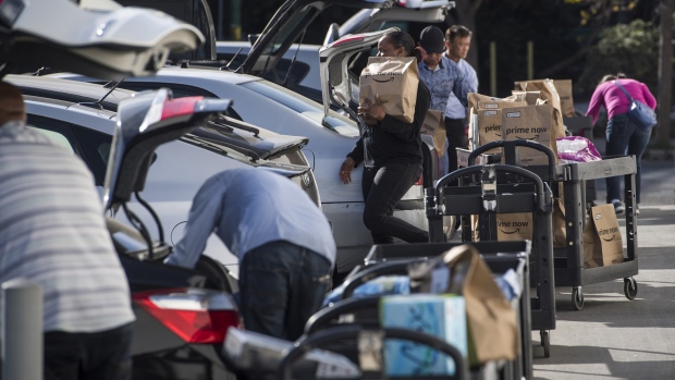 Drivers working for Amazon Flex load their cars with items to be delivered in San Francisco, on Oct. 30. 