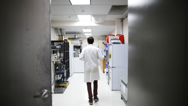 A lab technician walks through the Province Brands of Canada laboratory in Belleville, Ontario, Canada, on Friday, Aug. 31, 2018. Instead of infusing a drink with cannabinoids like THC or CBD, then masking the oily, bitter concoction with sugar as many beverage makers do in the U.S., Province Brands is developing beer brewed directly from the cannabis plant. 