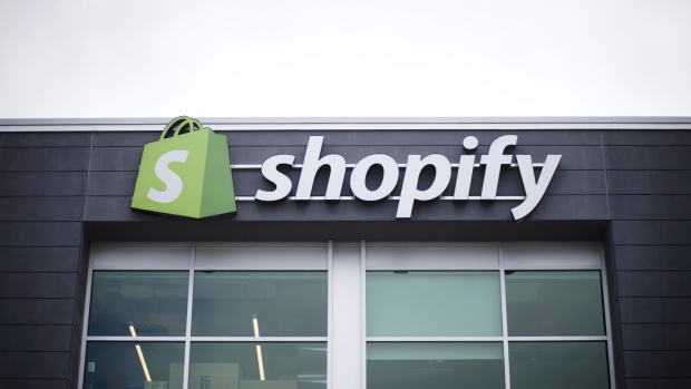 Signage is displayed at the Shopify Inc. office in Waterloo, Ontario, Canada, on Sept. 13, 2018. Shopify Plus, the company's highest-tiered subscription, is attracting migrations from other platforms. In 2Q, more than 50% of customers that were added to the service were new to the Shopify platform. 
