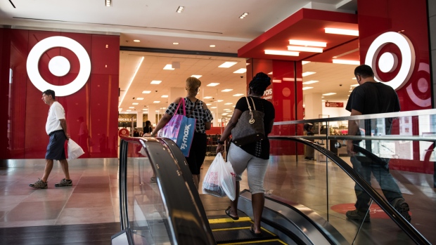 Shoppers walk towards a Target Corp. store at City Point in the Brooklyn borough of New York. 