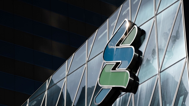 The Standard Chartered Plc logo is displayed atop the Standard Chartered Wealth Management Centre in Hong Kong, China, on Tuesday, July 31, 2018. Standard Chartered, one of the biggest financiers of global trade, isn’t losing sleep over an increasingly fractious relationship between the world’s two largest economies. 