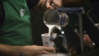 A barista pours frothed milk into a drink inside a Starbucks Corp. coffee shop in New York, U.S., on Monday, Jan. 18, 2016. 