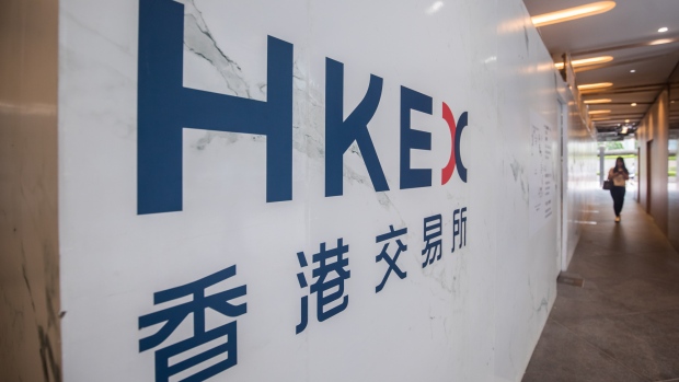 Signage for Hong Kong Exchanges & Clearing Ltd. (HKEx) is displayed at the Exchange Square complex in Hong Kong, China, on Wednesday, Aug. 9, 2017. HKEx, Asia's largest bourse operator by market value, said second-quarter profit was HK$1.78 billion ($230 million), a 14 percent increase from HK$1.55 billion a year earlier. 