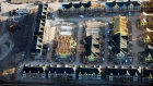 Homes under construction stand in this aerial photograph taken above Toronto, Ontario, Canada. 