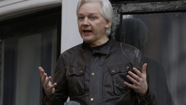 Julian Assange Photographer: Luke MacGregor/Bloomberg