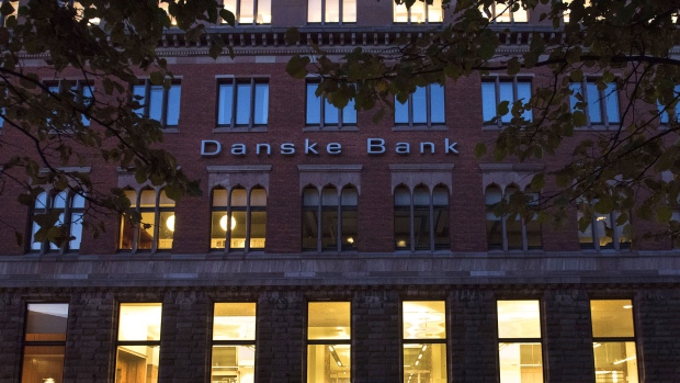 An automobile drives past Danske Bank A/S finance center in Copenhagen, Denmark, on Tuesday, Sept. 18, 2018. Danske Bank A/S Chief Executive Officer Thomas Borgen will step down amid allegations his bank was at the center of a major European money laundering scandal with as much as $234 billion flowing through a tiny unit in Estonia. 