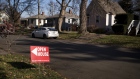 An "Open House" sign is displayed in the front yard of a home for sale in Columbus, Ohio, U.S., on Sunday, Dec. 3, 2017. Photographer: Ty Wright/Bloomberg