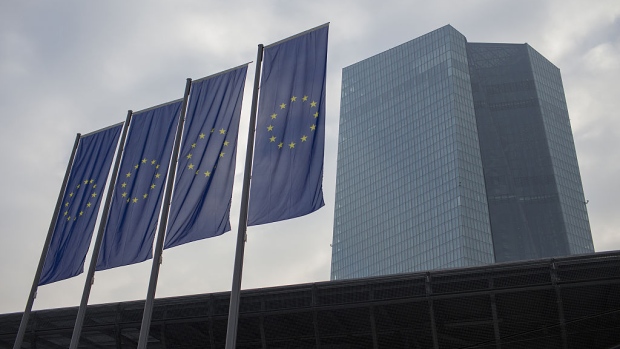 The stars of the European Union (EU) sit on banners flying in front of headquarter skyscraper offices of the European Central Bank (ECB) in Frankfurt, Germany, on Thursday, Jan. 21, 2016. European stocks rebounded from their biggest slump since August, before the ECB's rate decision and comments by President Mario Draghi. 