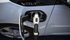 A ClipperCreek Inc. charging plug is seen connected to a General Motors Chevrolet Volt electric vehicle at a charging station in Los Angeles. 