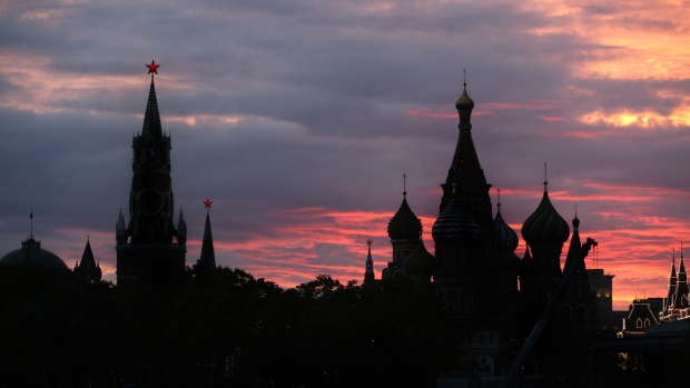 The Spasskaya tower, left, and St. Basil's cathedral, right, stand silhouetted in Moscow, Russia, on Wednesday, July 5, 2017. U.S. officials, including Brett McGurk, the U.S. envoy for the coalition to fight the Islamic State, have been quietly meeting with Russian counterparts for weeks to lay the groundwork for cooperation. 