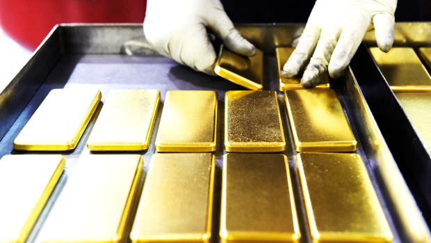 An employee arranges one kilogram gold bars at the Perth Mint Refinery, operated by Gold Corp., in Perth, Australia, on Thursday, Aug. 9, 2018. Demand for coins and minted bars was a little sluggish over the past year as Donald Trump's earlier win in the presidential poll prompted investors to divert funds into stocks, bonds and property, said Perth Mint's Chief Executive Officer Richard Hayes on Aug. 8. 