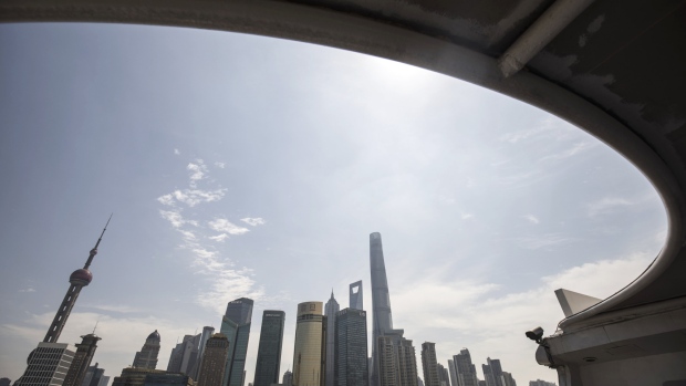 Buildings of Pudong's Lujiazui financial district stand across the Huangpu River in Shanghai, China, on Saturday, June 2, 2018. China's banks, scrambling to adjust to the government's deleveraging campaign, are likely to add to pressures on the corporate bond market as they shed more of their massive note holdings and de-risk their balance sheets. 
