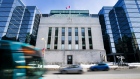 Vehicles drive past the Bank of Canada offices in Ottawa, Ontario, Canada, on Monday, March 20, 2017.