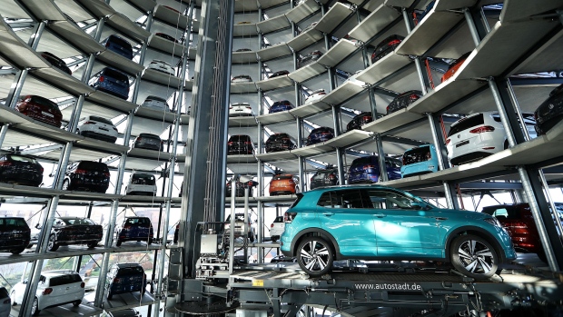 A new Volkswagen AG (VW) T-Cross compact SUV is guided into a storage bay inside one of the automaker's Autostadt delivery towers at the VW headquarters in Wolfsburg, Germany, on Tuesday, Dec. 4, 2018. VW would support eliminating tariffs on exported cars between the European Union and the U.S., the German automaker's strategy head Michael Jost said today at the Handelsblatt auto industry conference. 