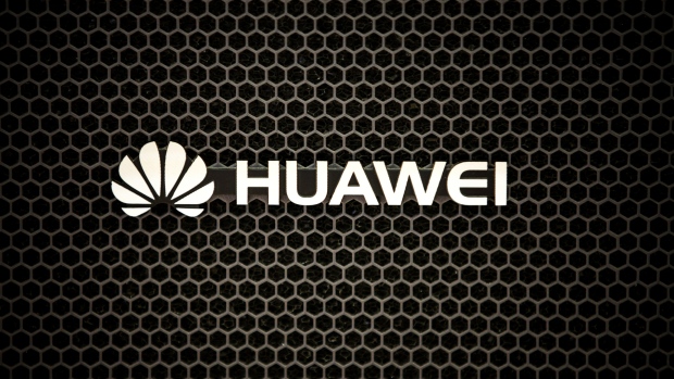 The Huawei Technologies Co. logo is displayed in an exhibition hall at the company's headquarters in Shenzhen, China, on Tuesday, June 5, 2018. Facebook Inc. said it had data-sharing partnerships with four Chinese consumer-device makers, including Huawei, escalating concerns that the social network has consistently failed to tell users how their personal information flows beyond Facebook. 